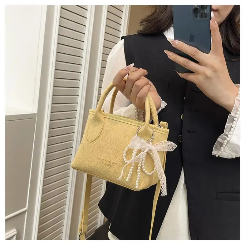 Chic Yellow Pebbled Leather Crossbody Bag with Pearl Bow Charm – Cute Top Handle Satchel