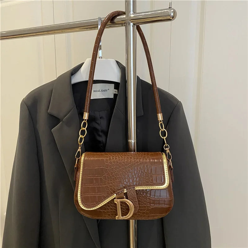 Elegant Crocodile Pattern Saddle Shoulder Bag with Gold "D" Accent and Strap