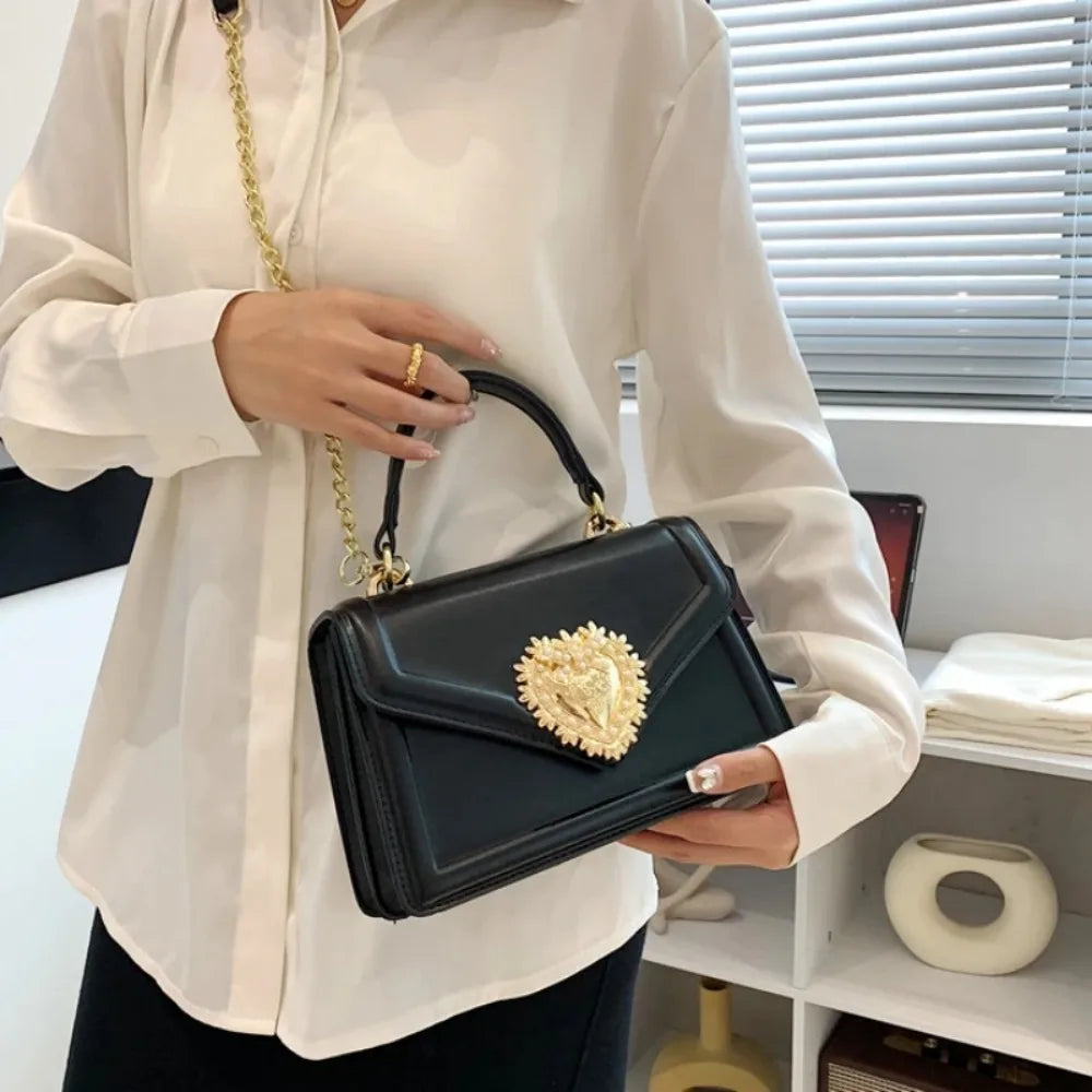Aura Bags Elegant Brown Flap Handbag with Pearl-Accented Heart Clasp and Chain Strap