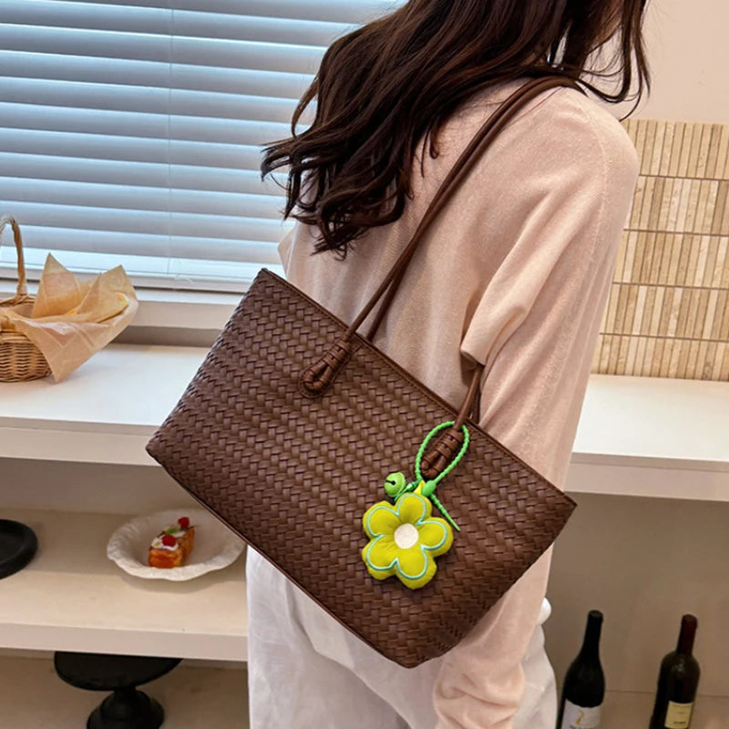 Elegant Woven Leather Tote Bag with Cute Flower Pendant and Long Shoulder Straps
