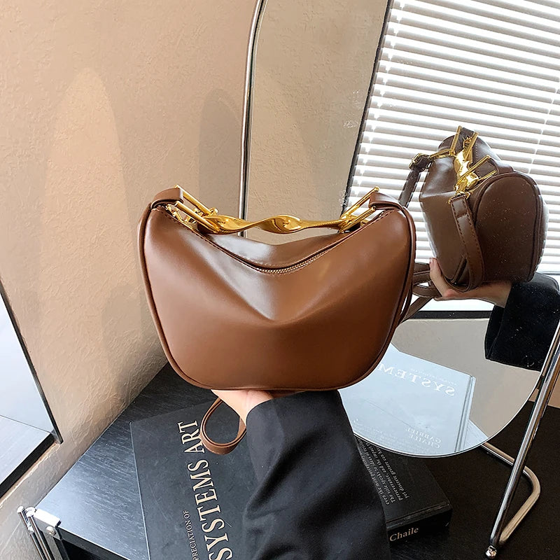 Aura Bags Luxurious Maroon Vegan Leather Handbag with Sculpted Gold Handle