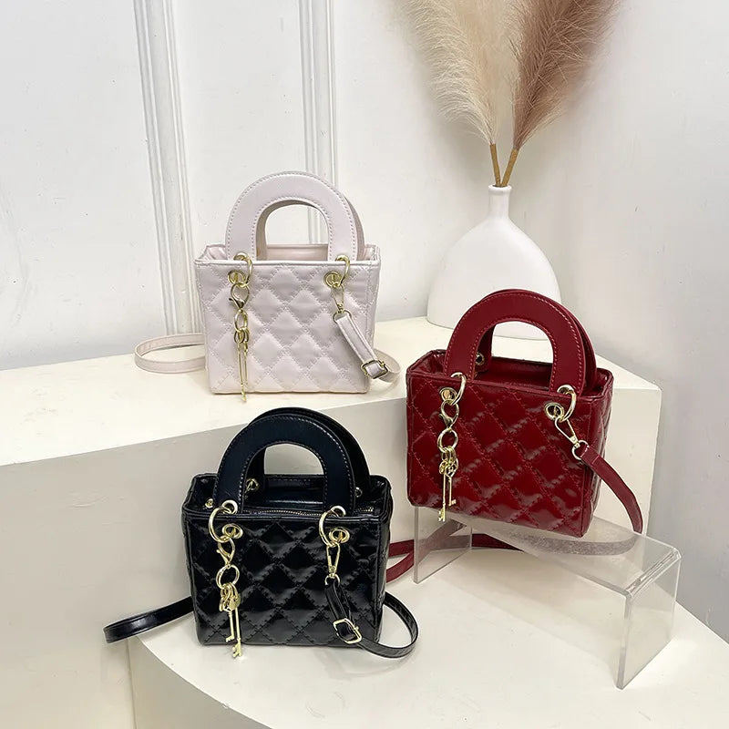 Aura Bags Glossy Red Quilted Handbag with Golden Key Charm & Detachable Strap