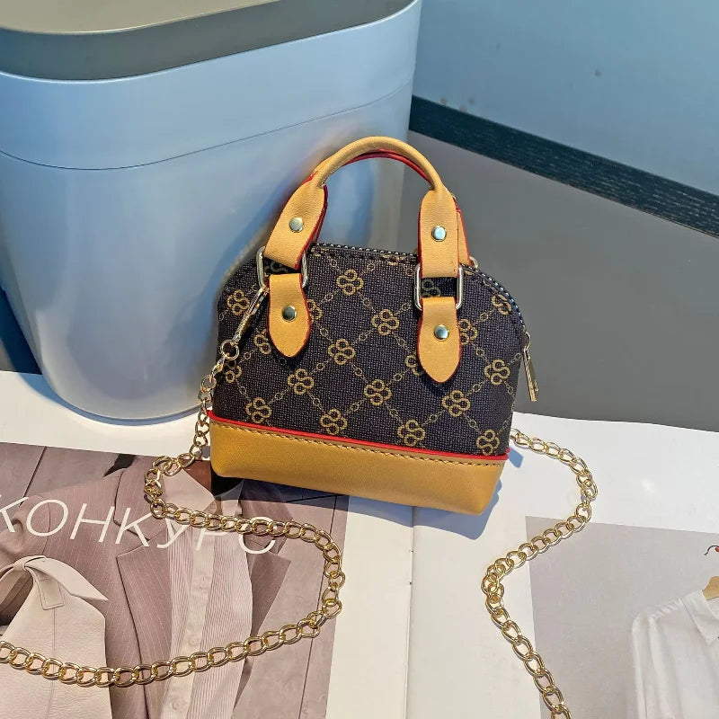 Chic Monogram Pattern Mini Dome Handbag with Top Handle and Keychain Accent
