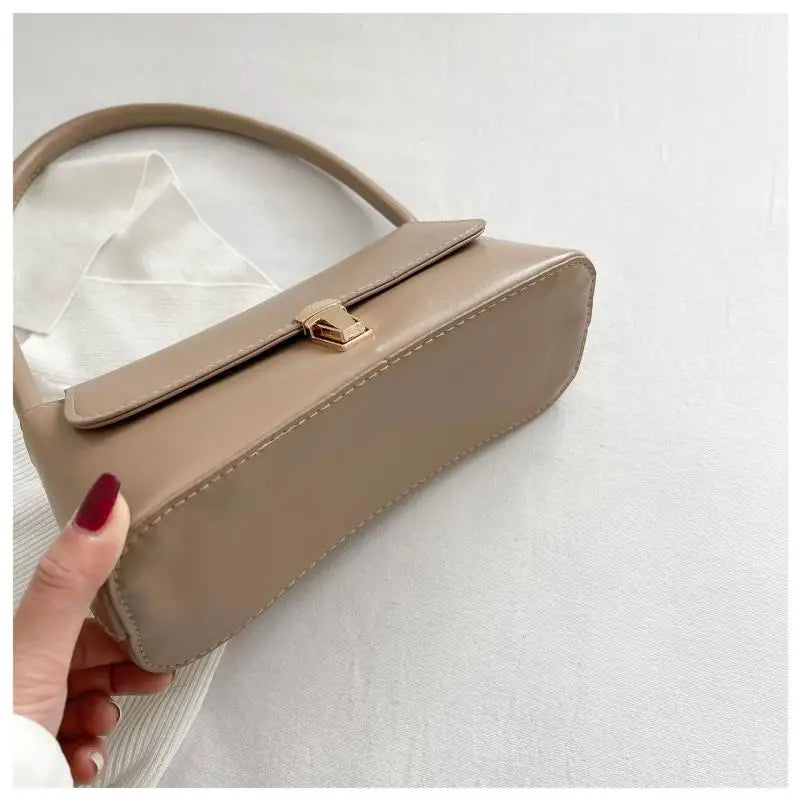 Minimalist Beige Leather Baguette Shoulder Bag with Gold Lock Accent