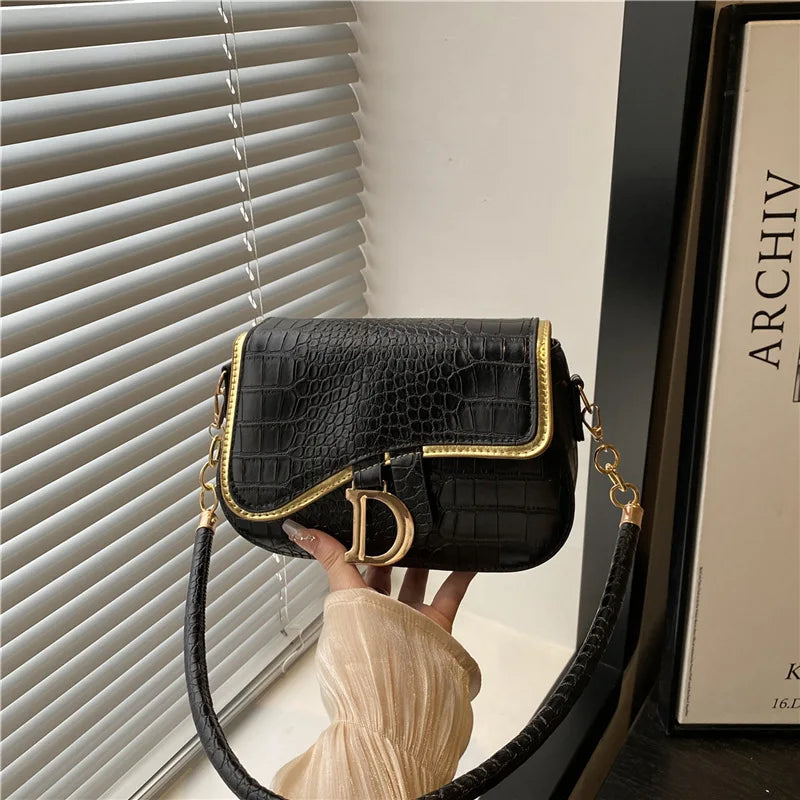 Elegant Crocodile Pattern Saddle Shoulder Bag with Gold "D" Accent and Strap