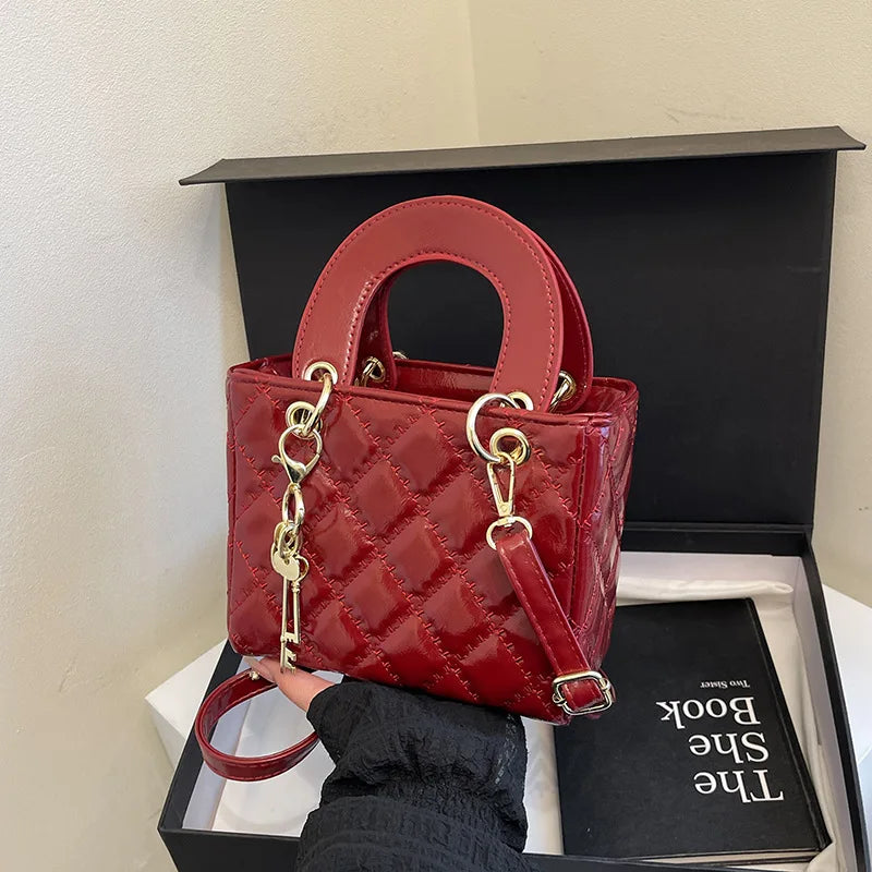 Aura Bags Glossy Red Quilted Handbag with Golden Key Charm & Detachable Strap