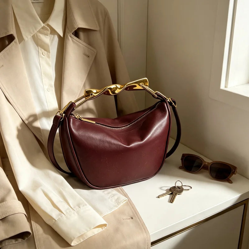 Aura Bags Luxurious Maroon Vegan Leather Handbag with Sculpted Gold Handle