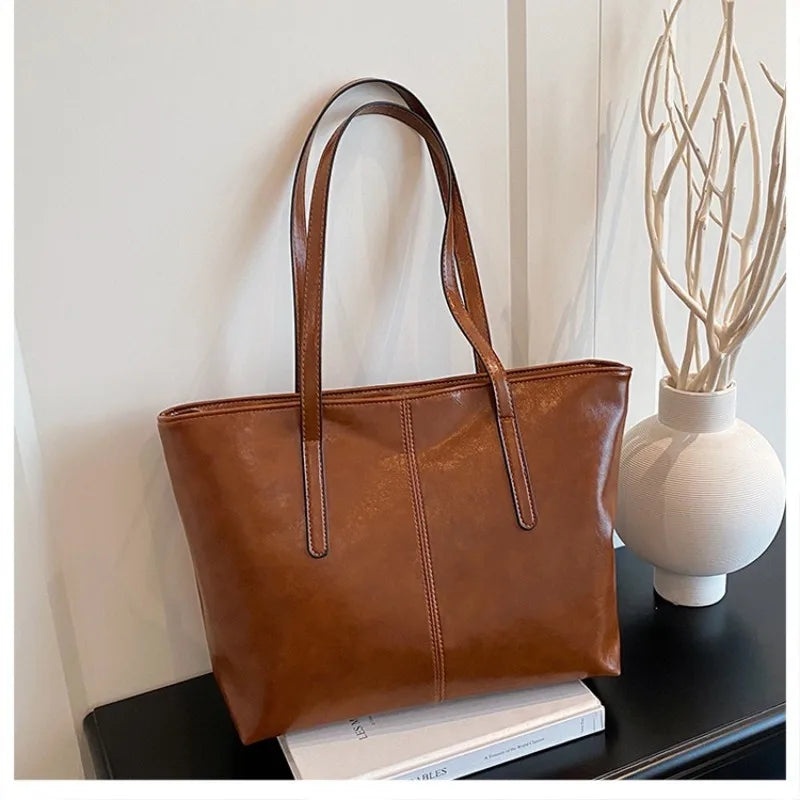 Classic Black Leather Tote Bag with Sports Charm – Spacious Work & Casual Shoulder Bag for Women