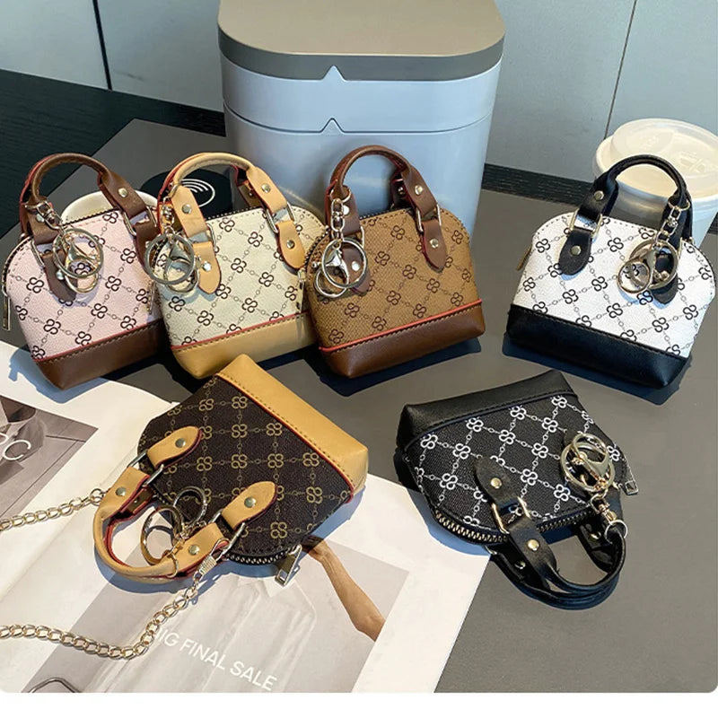 Chic Monogram Pattern Mini Dome Handbag with Top Handle and Keychain Accent