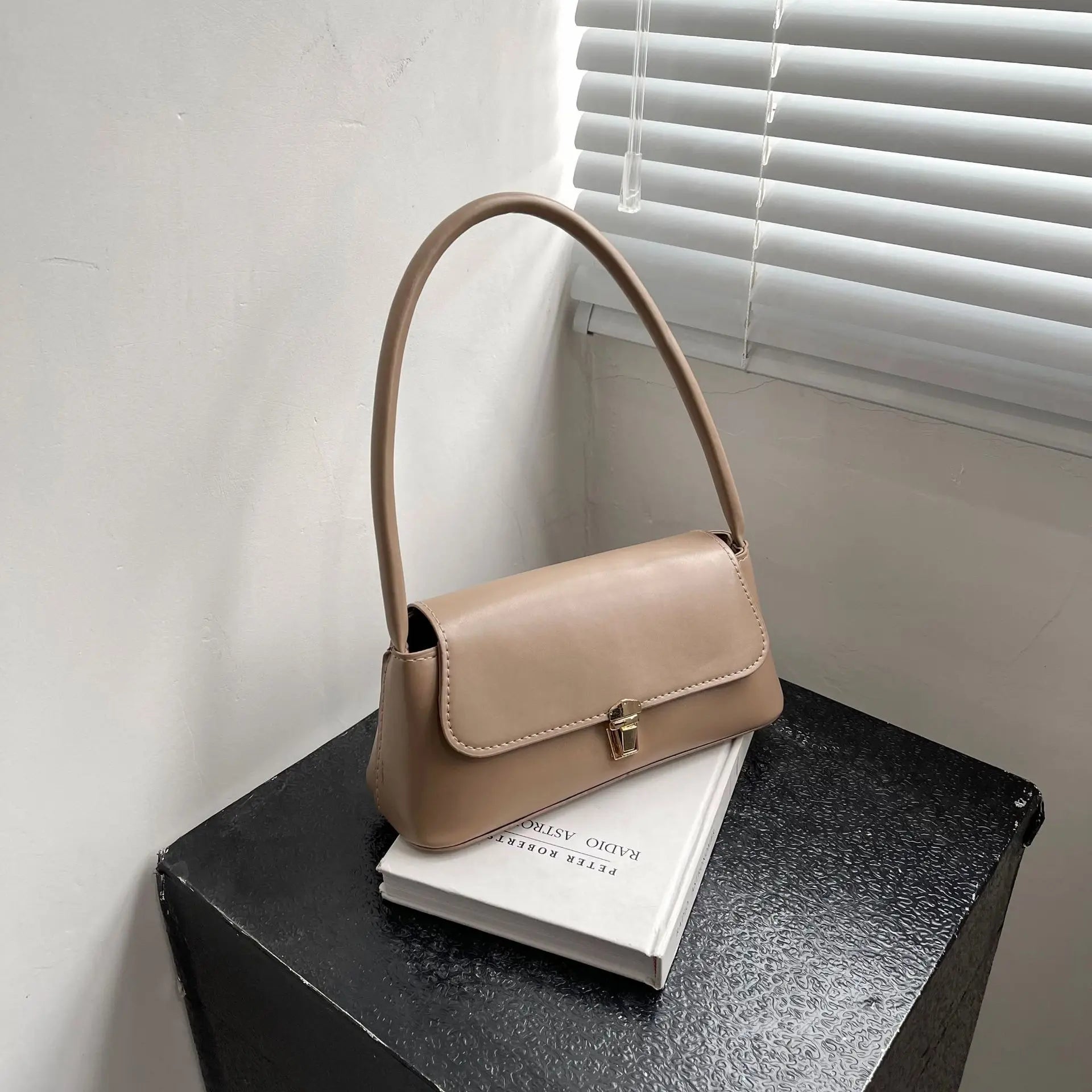 Minimalist Beige Leather Baguette Shoulder Bag with Gold Lock Accent