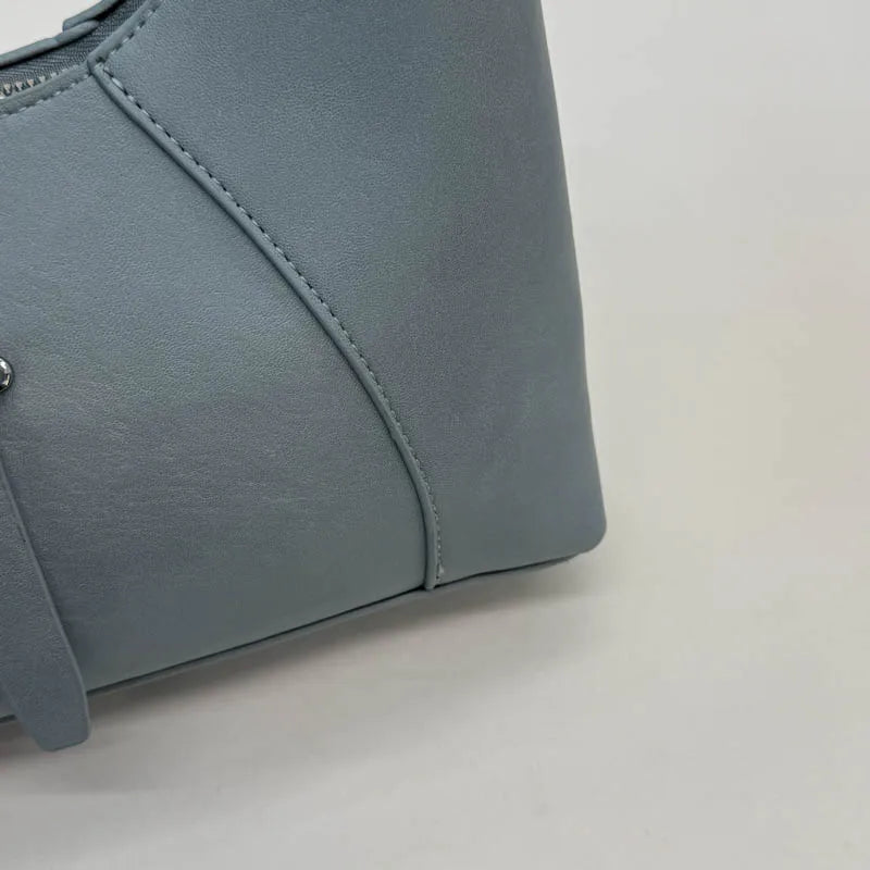 Aura Bags Chic Minimalist Beige Crescent Shoulder Bag with Buckle Detail