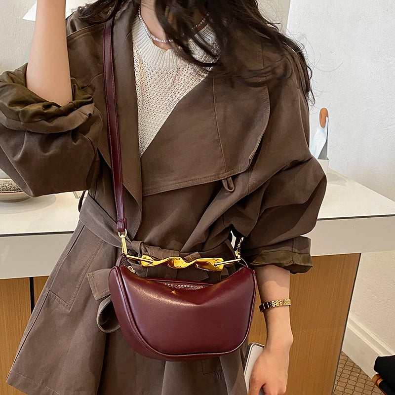 Aura Bags Luxurious Maroon Vegan Leather Handbag with Sculpted Gold Handle