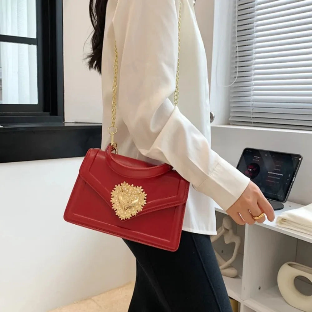 Aura Bags Elegant Brown Flap Handbag with Pearl-Accented Heart Clasp and Chain Strap