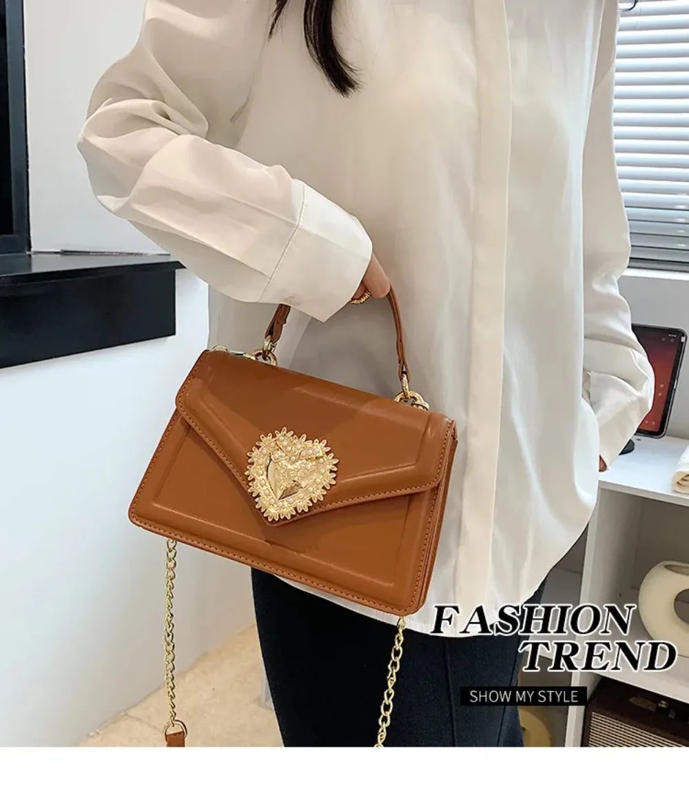 Aura Bags Elegant Brown Flap Handbag with Pearl-Accented Heart Clasp and Chain Strap