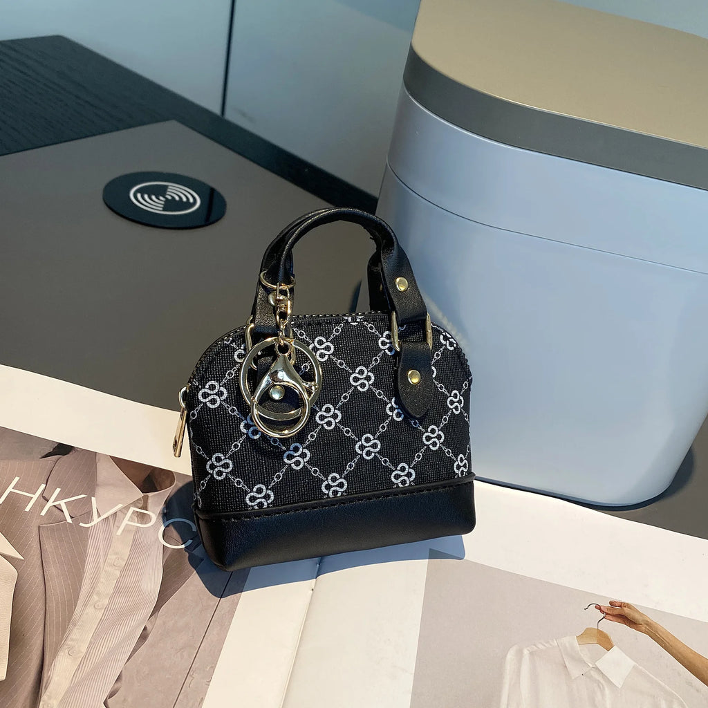 Chic Monogram Pattern Mini Dome Handbag with Top Handle and Keychain Accent