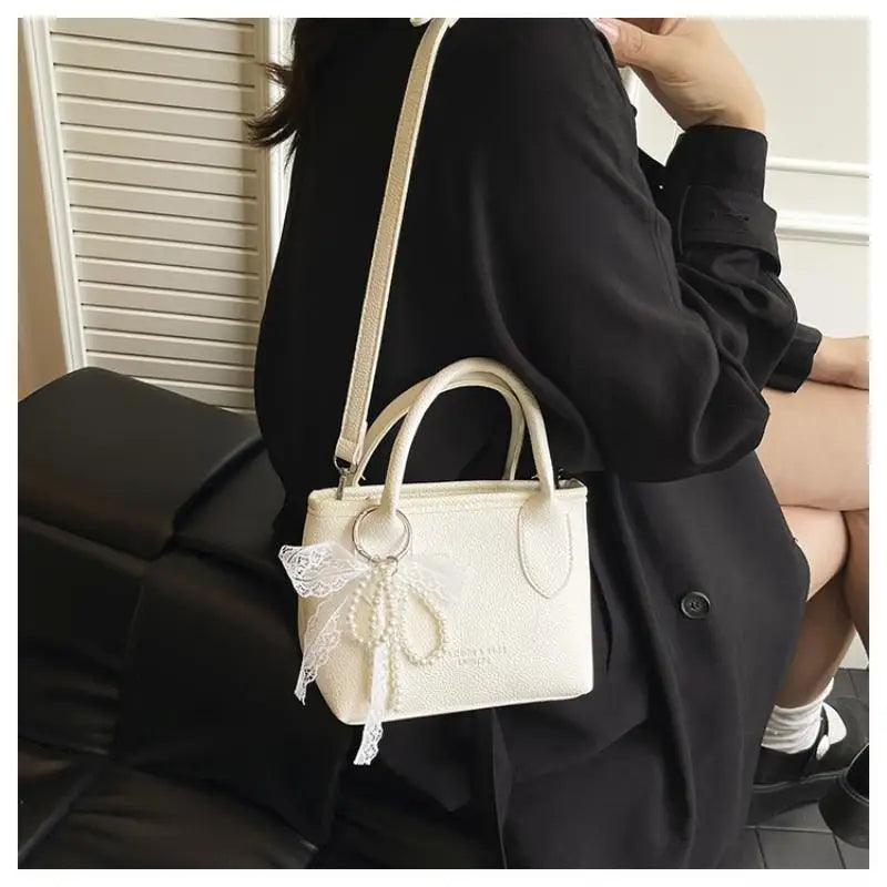 Chic Yellow Pebbled Leather Crossbody Bag with Pearl Bow Charm – Cute Top Handle Satchel
