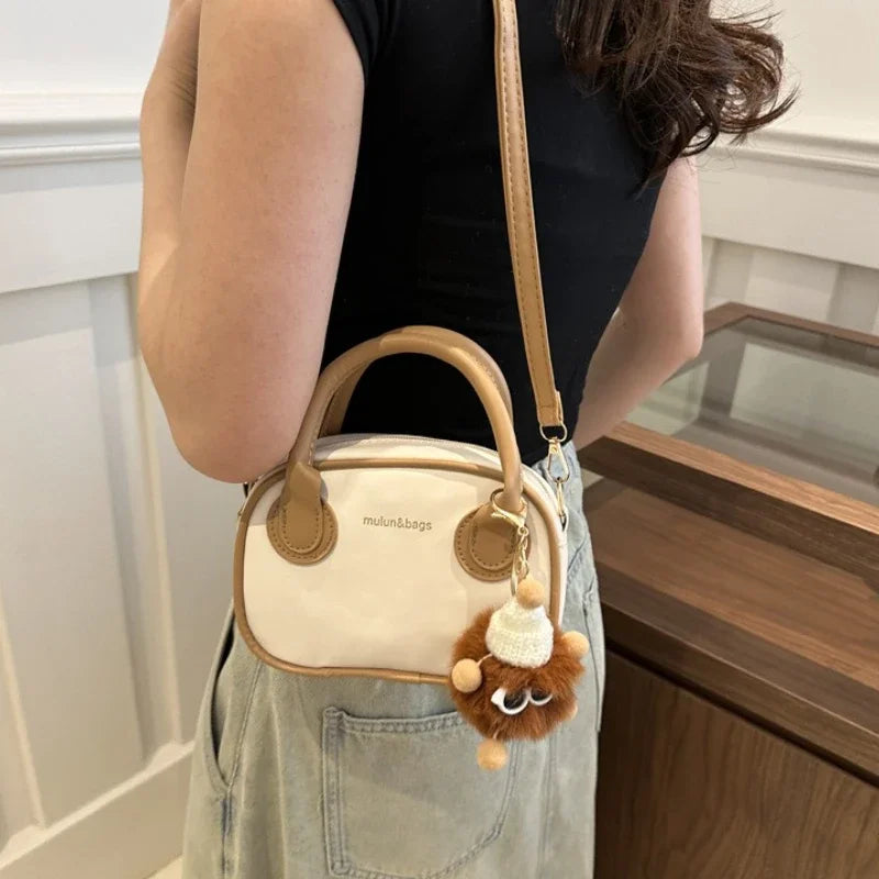 Casual Two-Tone Mini Barrel Crossbody Bag with Fluffy Pendant