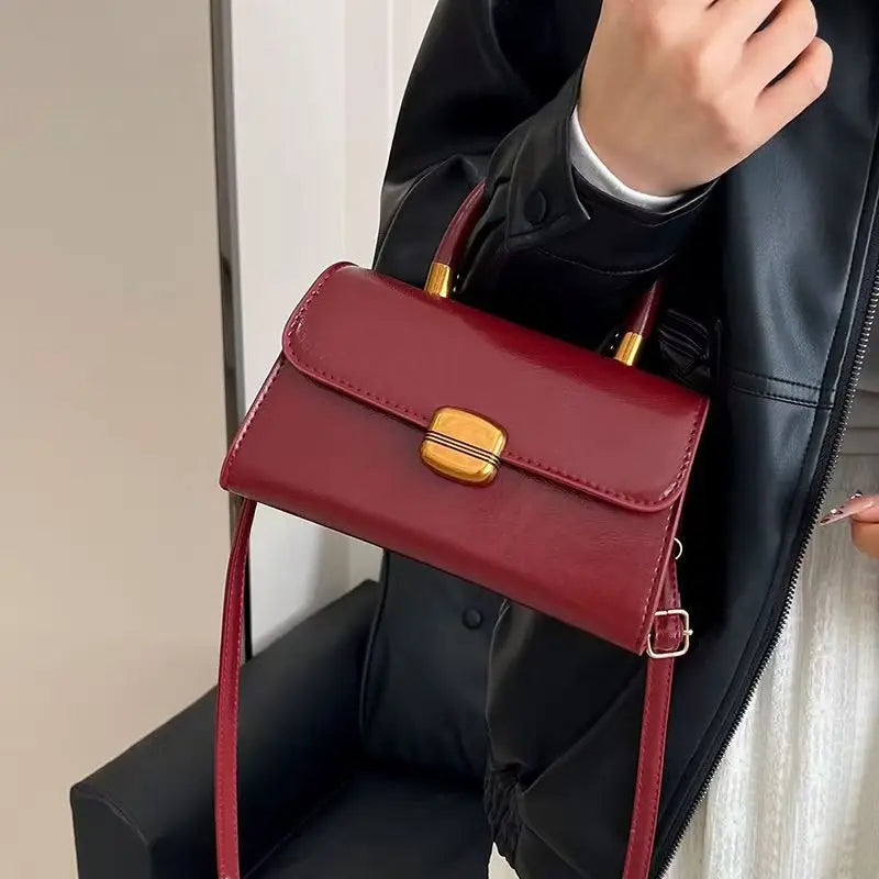 Structured Burgundy Crossbody Bag with Gold Lock Clasp | Chic Top-Handle Purse