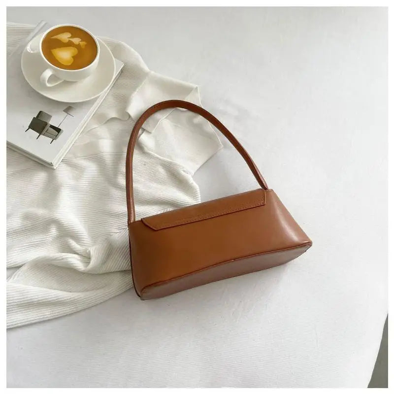 Minimalist Beige Leather Baguette Shoulder Bag with Gold Lock Accent